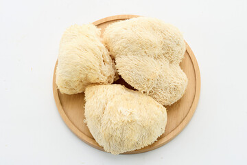 Lion's Mane Mushrooms on Wooden Plate