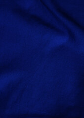 Dark blue velvet fabric background in a luxurious style