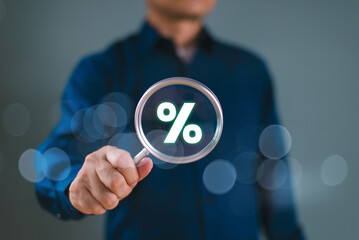 Interest rate rise, dividend money investment concept. Business provision of financial service. Man use magnifying glass finding on house loan interest rate percentage icon, mortgage rate real estate
