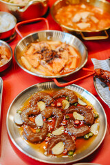 Traditional Korean food. Korean rice cake (Tteokbokki) with spicy sauce and Fresh Shrimp marinated in a mild soy sauce topping with sesame. 