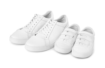 Big and small sneakers isolated on white