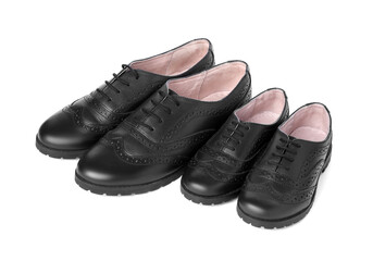 Big and small shoes isolated on white