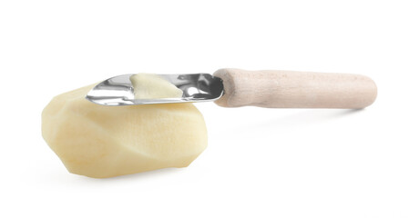 Fresh raw potato and peeler isolated on white
