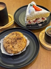 Japanese desserts cake and choux cream with coffee and cappuccino