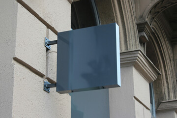 Street storefront shop, cafe, restaurant mounted signboard mock up design template. Blank white store sign design mockup.