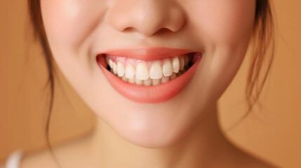 Obraz premium Close-up of a woman's bright, white smile with pink lips. A beautiful, healthy smile. Perfect for dental care, beauty, and happiness concepts.