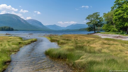 A tranquil riverbank with smooth stones meets the calm waters, bordered by verdant mountains and a cloudy sky, showcasing the beauty of nature in a remote location