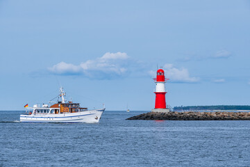 An excursion boat returns to the port of Warnemünde