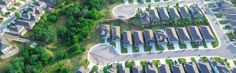 Panorama aerial double cul-de-sac dead-end keyhole street in new development residential neighborhood row of two-story houses well-trimmed landscape, fenced backyard, suburbs East of San Antonio