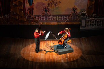 Elegant theater performance with vibrant stage decorations. Classical music concept.