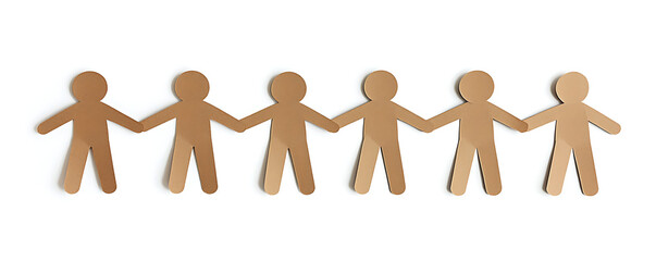 A row of brown paper cutouts shaped like human figures holding hands symbolizing unity and teamwork against a white background