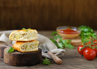 homemade pie with meat and potatoes on a wooden board