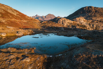 Naklejka premium Landscape of sunrise shine over Lac Guichard with rocky mountain in autumn at France