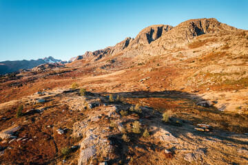 Fototapeta premium Landscape of sunrise shine over Lac Guichard with rocky mountain in autumn at France