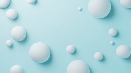 Collection of white spheres of varying sizes arranged on a light blue background