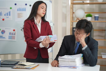 Young Asian couple celebrating together Look at the laptop computer in the home office. successful work To start a small business Asian couple calculates budget or expenses by holding bills at home