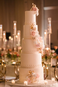 White Wedding Cake in an Indoor Wedding Reception Ballroom