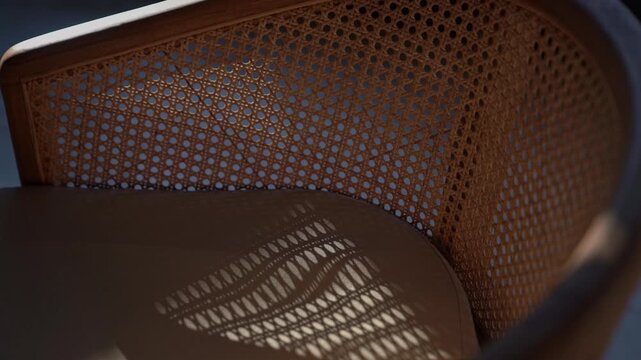 Mesh wooden chair on the sun rays