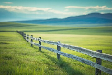 Wooden Fence and Open Field: An image featuring a simple wooden fence stretching across a serene, open field.