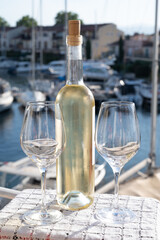Glasses of cold rose gris Cote de Provence wine in yacht harbour of Port Grimaud, summer vacation on French Riviera in Provence, France, wine tasting