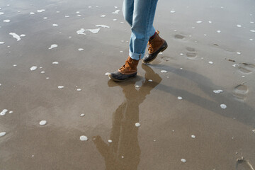 Walking on beach with rain boots
