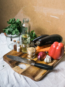 Assorted Vegetables and Ingredients on Cutting Board