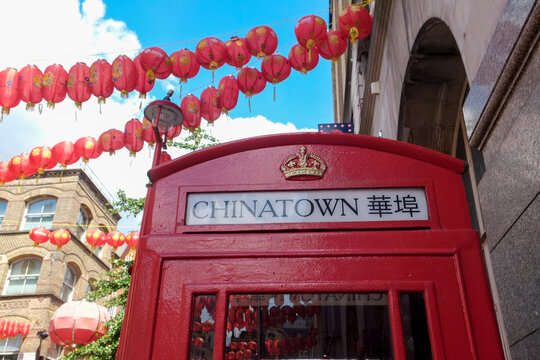 London, England, Great Britain.. Old red phone booth in Chinatown