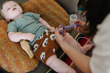 Mother with a baby who needs food through the tube