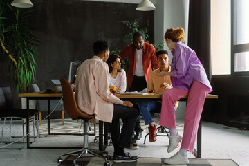 Multicultural workers group having conversation. Discussing in office