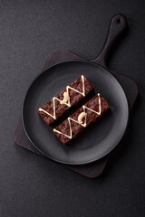 Delicious sweet brownies with chocolate and nuts