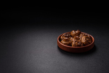 Delicious juicy whole champignons baked on the grill with salt and spices
