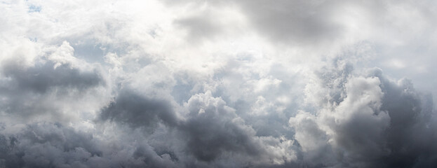 Gray thick rain clouds in the autumn sky