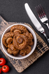 Delicious juicy whole champignons baked on the grill with salt and spices