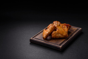 Delicious fried chicken wings with salt, spices and herbs