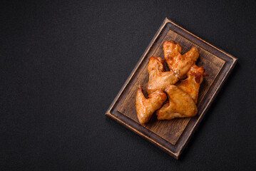 Delicious fried chicken wings with salt, spices and herbs