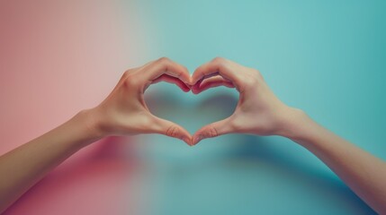 a man's and a woman's hand form a heart symbol.