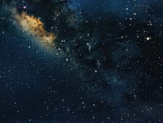 Fototapeta premium A starry night sky with a bright yellow star in the middle. The stars are scattered throughout the sky, creating a sense of depth and vastness