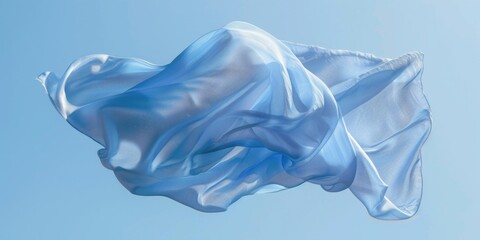 Fototapeta premium A blue and white fabric is floating in the air. Concept of freedom and lightness, as the fabric appears to be weightless and untethered. The blue and white colors create a calming