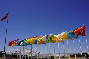 Flags of 16 Turkish states under the deep blue sky: Flags of 16 Turkish States behind the Great...