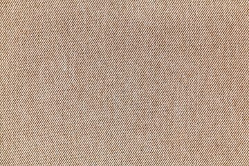 Closeup, macro of brown jeans denim fabric texture background, cloth with diagonal weawing