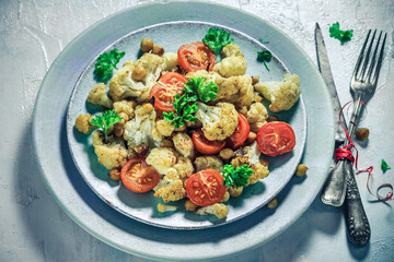 Delicious vegetable dish cauliflower baked chickpeas tomatoes