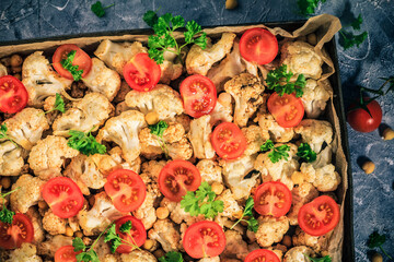 Ingredients Vegan dish cauliflower baked chickpeas tomatoes