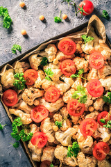 Vegan dish cauliflower baked chickpeas tomatoes
