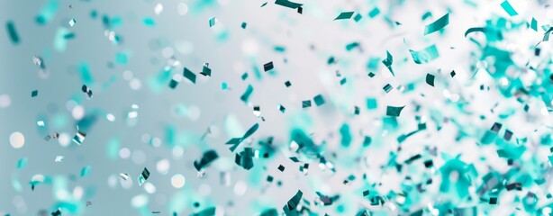Colorful confetti is joyfully scattered on a bright backdrop, perfect for festive occasions like parties