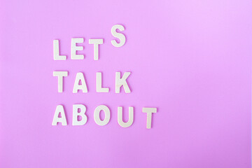 words 'lets talk about' made out of wooden letters, illustration