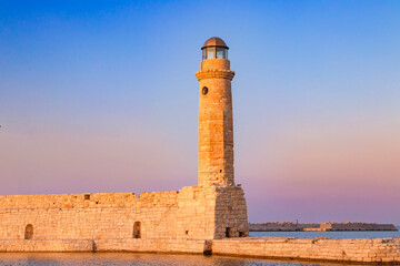 Old lighthouse at port of Rethymno town, Crete island, Greece.
