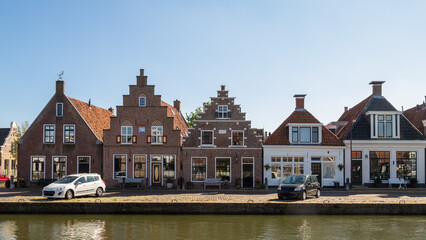 Historic canal houses in the center of the town of Makkum in Friesland.
