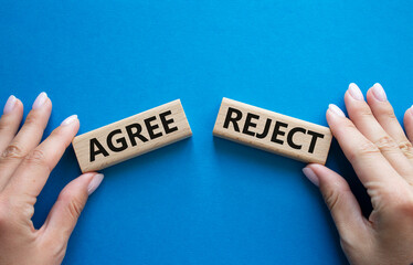 Agree or Reject symbol. Concept word Agree or Reject on wooden blocks. Businessman hand. Beautiful...