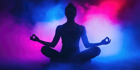 Silhouette of a Person Meditating with Vibrant Neon Colors in the Background