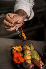 man arranging vegetables for eating